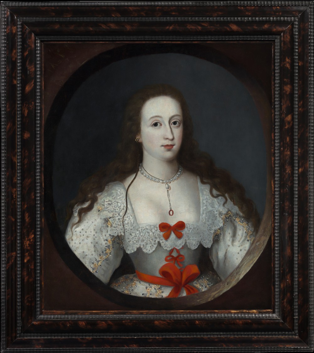 A 17th-century Jacobean oil portrait depicting a lady with long dark hair in a white lace dress with red ribbon bows, framed in dark wood.