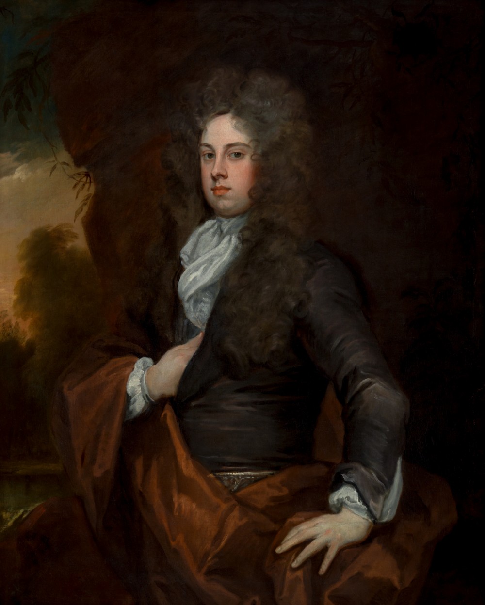 An 18th-century oil portrait depicting a young man in a wig and dark coat within an ornate gold gilt frame. View VI