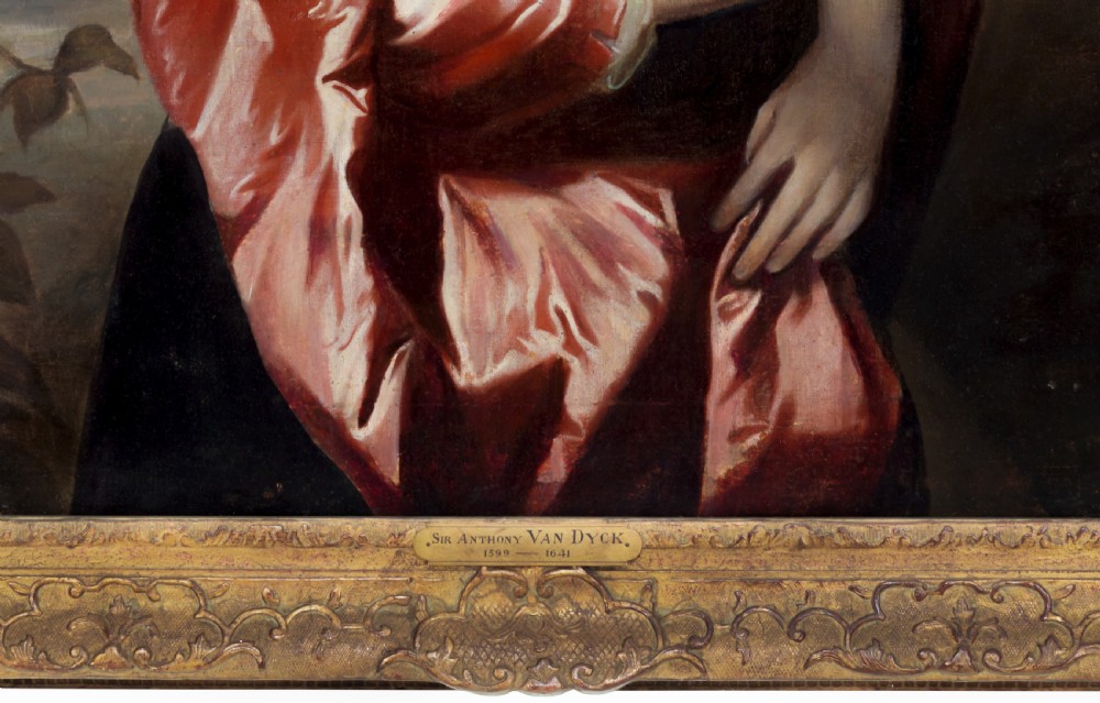 A seventeenth-century oil portrait of a lady wearing a black dress with red satin sleeves and pearls, housed in a carved gilded frame. View V