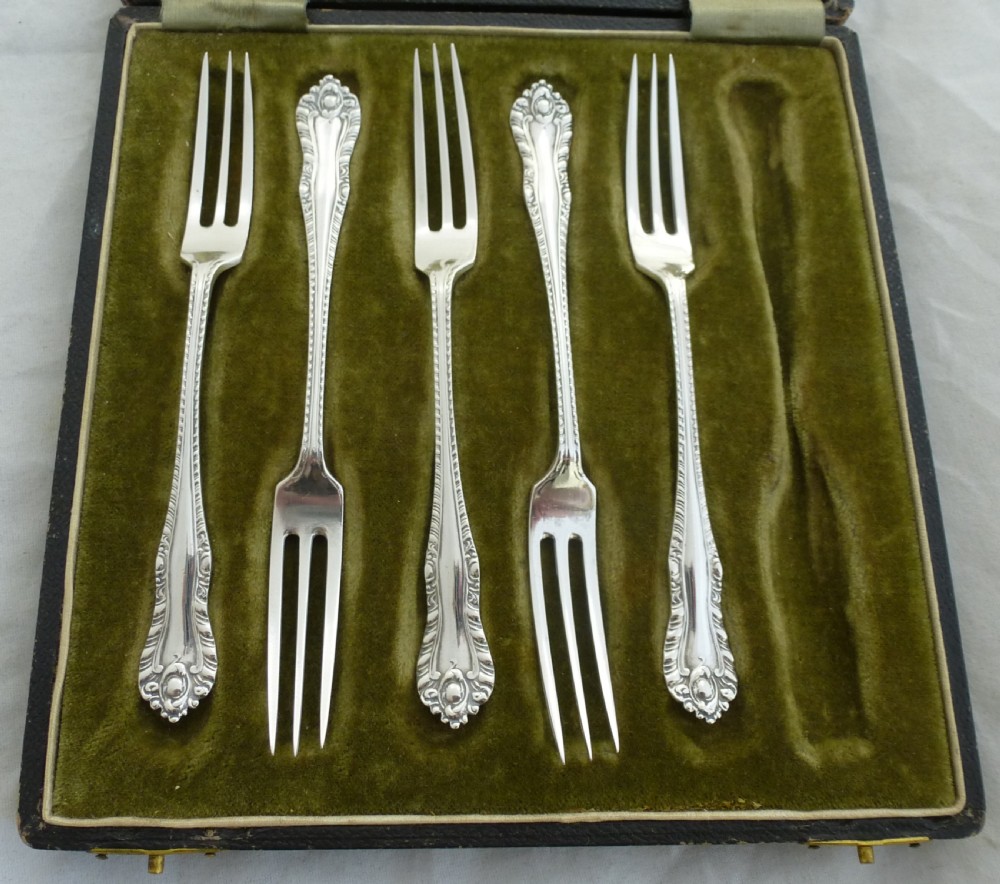 Five Cased Silver Cake Forks