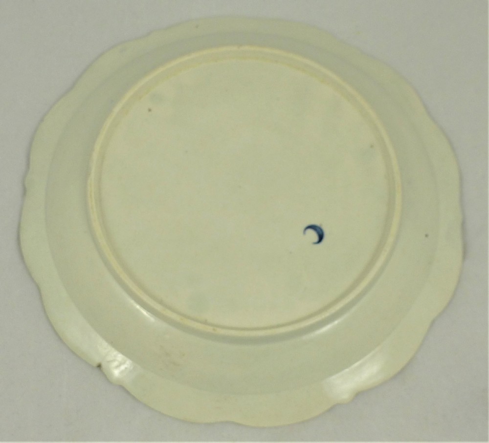 An eighteenth-century blue and white Worcester porcelain strawberry dish with pierced drainage holes resting on a matching scalloped stand. View VI