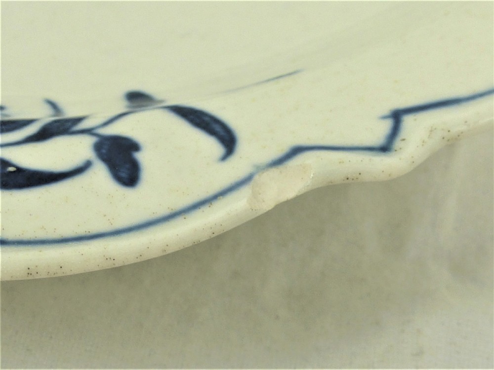 An eighteenth-century blue and white Worcester porcelain strawberry dish with pierced drainage holes resting on a matching scalloped stand. View XIV