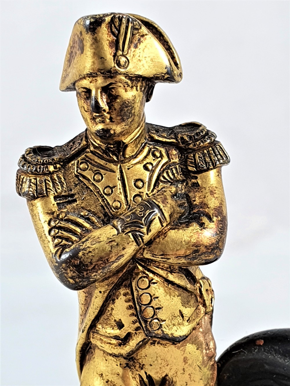 A late nineteenth-century French bronze statuette depicting Napoleon Bonaparte with arms crossed standing on a dark pedestal featuring a gilt eagle motif. View VIII