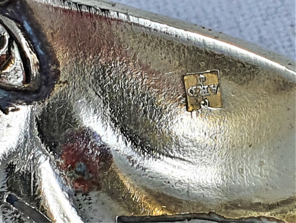 A nineteenth-century French silver-plated sugar sifter featuring a pierced shell-shaped gilded bowl and relief handle, presented in a dark fitted case. View XIV