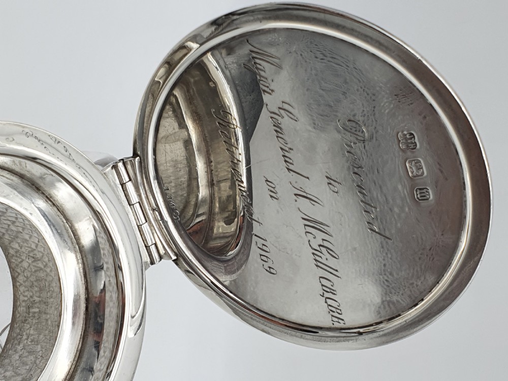 A late Victorian claret jug featuring a diamond-cut clear glass body paired with a polished sterling silver collar, hinged flat lid, fluted finial, and clear glass handle. View VII