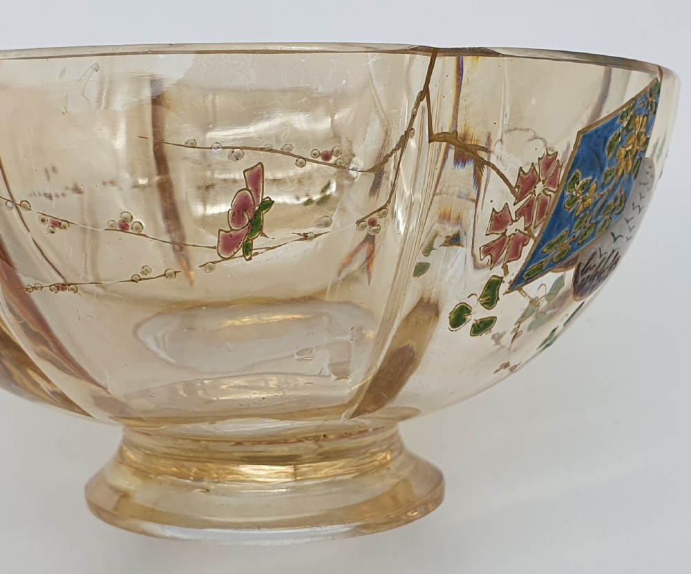 A footed amber crystal bowl featuring hand-enamelled Japanese-inspired floral motifs and geometric panels. View XVII
