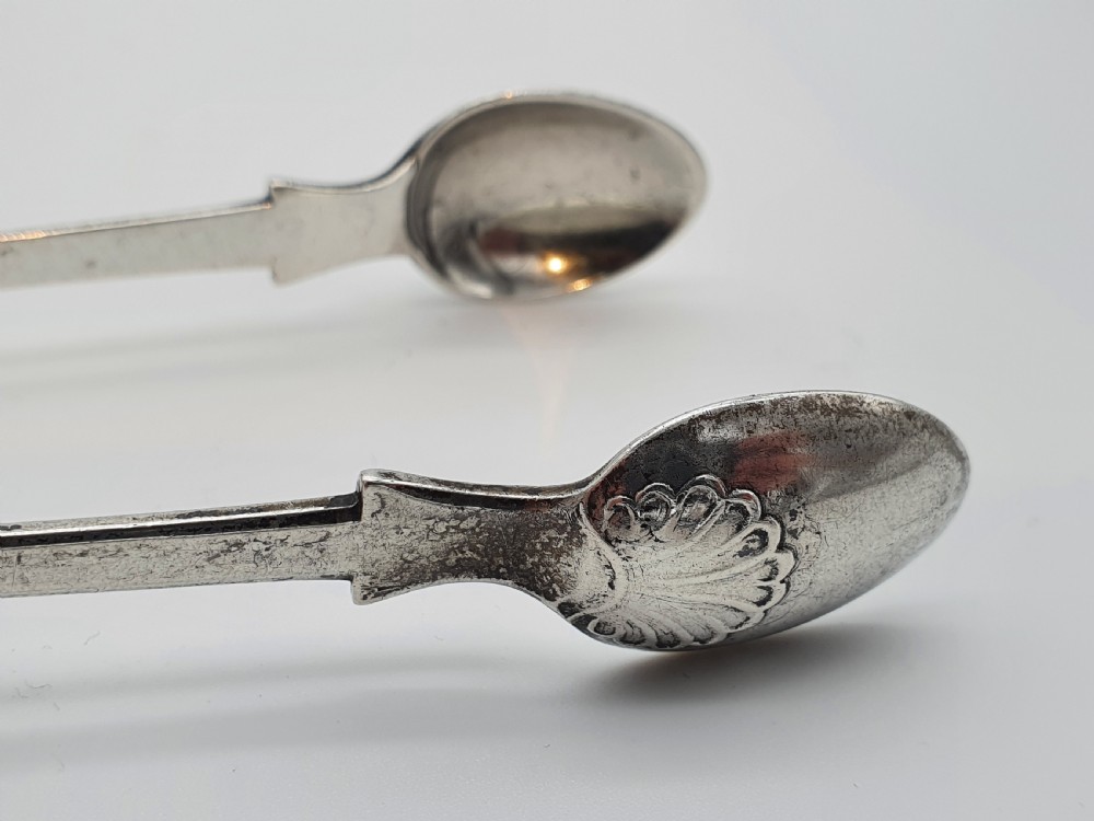 A pair of Victorian silver sugar tongs featuring shell motifs and spoon-shaped grips. View VII