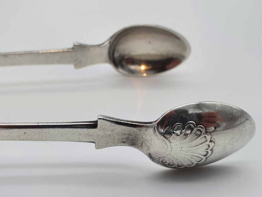 A pair of Victorian silver sugar tongs featuring shell motifs and spoon-shaped grips. View IX