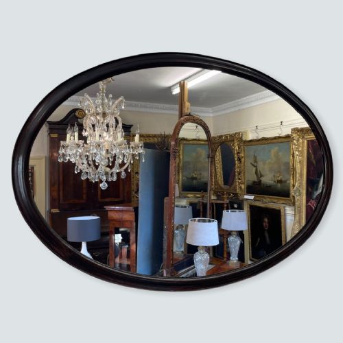 large ebonised oval mirror - CATEGORY: ANTIQUE MIRRORS - DATED 1900