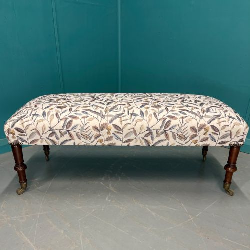 NEWLY UPHOLSTERED LEAF MOTIF FOOTSTOOL ON CASTORS - ADDITIONAL PHOTO 1