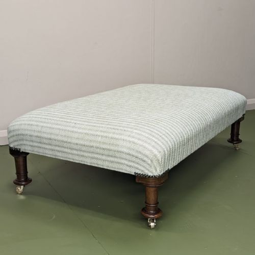 large newly upholstered footstool on castors - CATEGORY: ANTIQUE STOOLS - DATED 19TH CENTURY