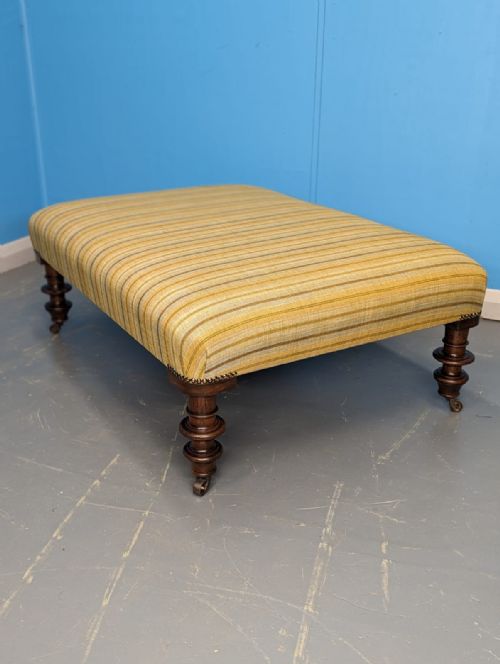 large newly upholstered footstool on castors - CATEGORY: ANTIQUE STOOLS - DATED 19TH CENTURY