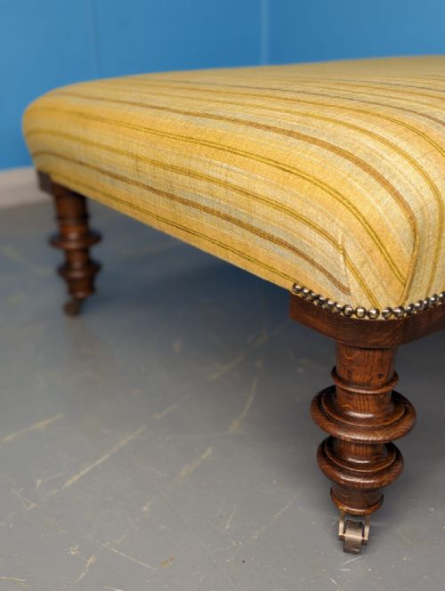 LARGE NEWLY UPHOLSTERED FOOTSTOOL ON CASTORS - ADDITIONAL PHOTO 1