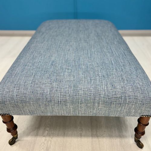 LARGE NEWLY UPHOLSTERED FOOTSTOOL ON REGENCY LEGS WITH CASTORS - ADDITIONAL PHOTO 3