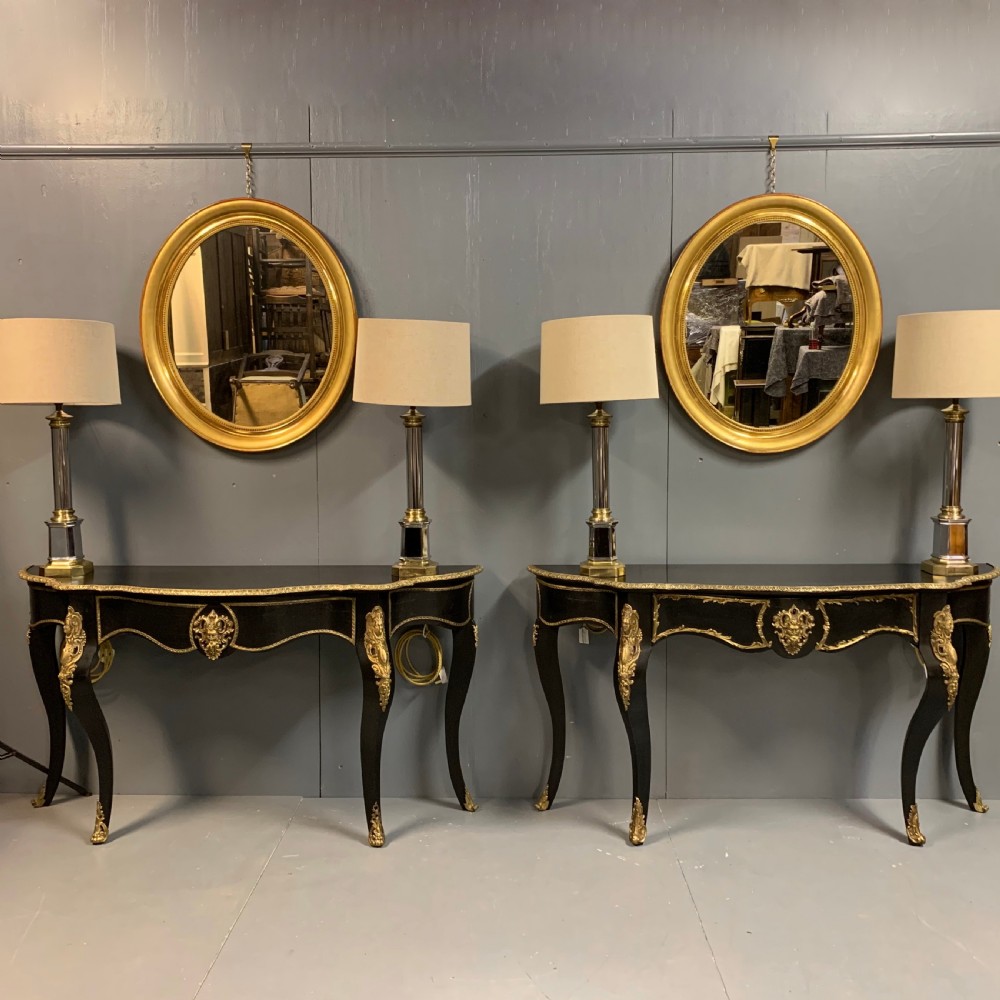 Pair of French ebonised console tables with brass mounts View III