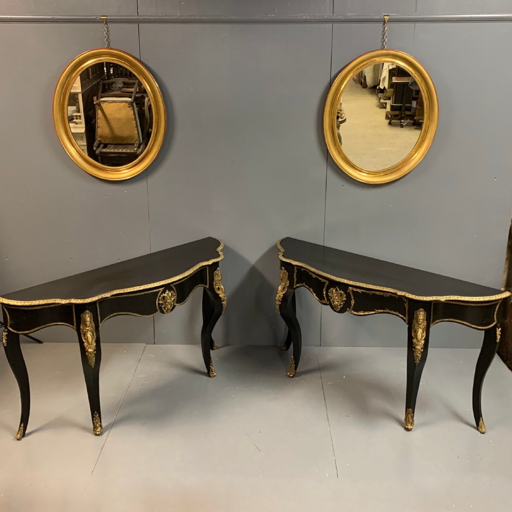 Pair of French ebonised console tables with brass mounts View XVI