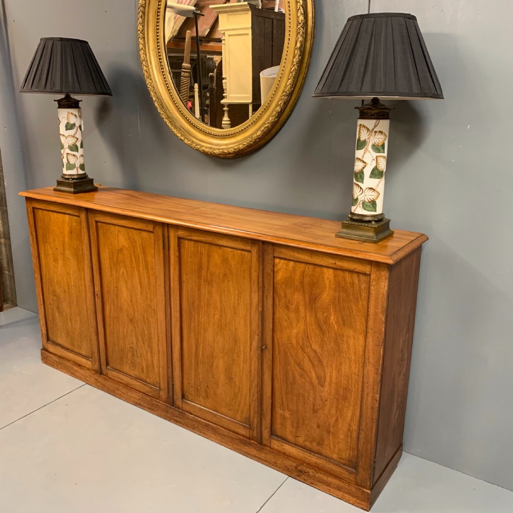 Slim four door mahogany low bookcase  View V