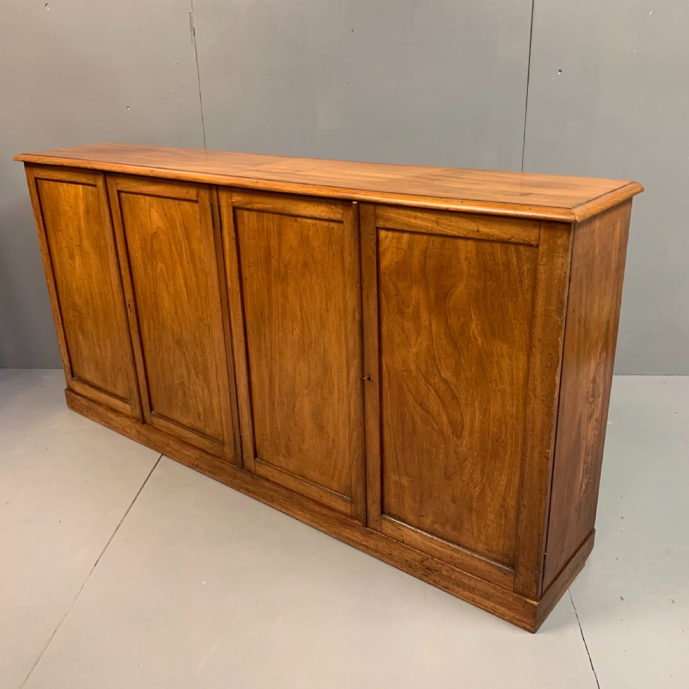 Slim four door mahogany low bookcase  View VI