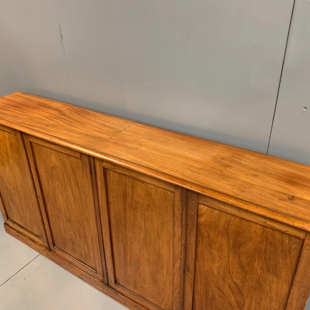 Slim four door mahogany low bookcase  View VII