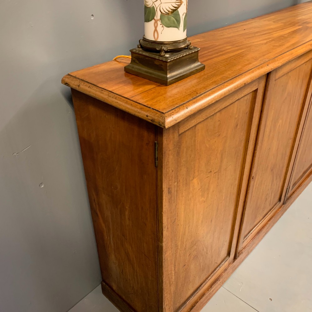 Slim four door mahogany low bookcase  View IX