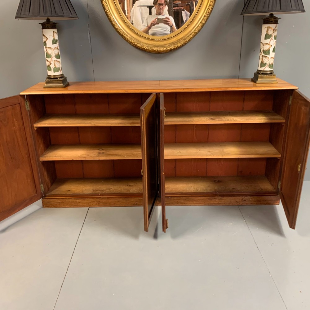 Slim four door mahogany low bookcase  View XI