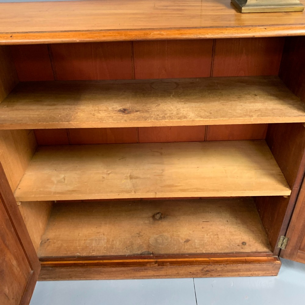 Slim four door mahogany low bookcase  View XII