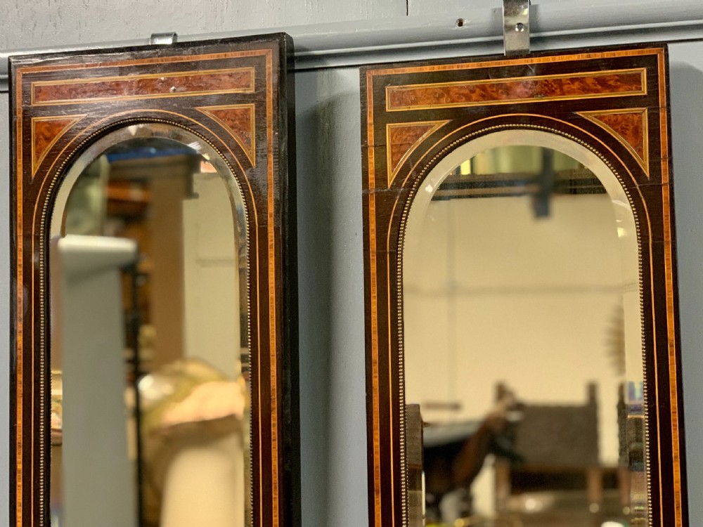 Pair of c19th amboyna and ebonised pier mirrors View V