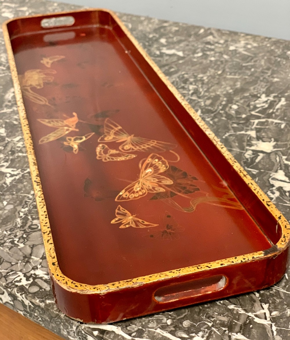 Chinese export red lacquered and gilt butterfly drinks tray