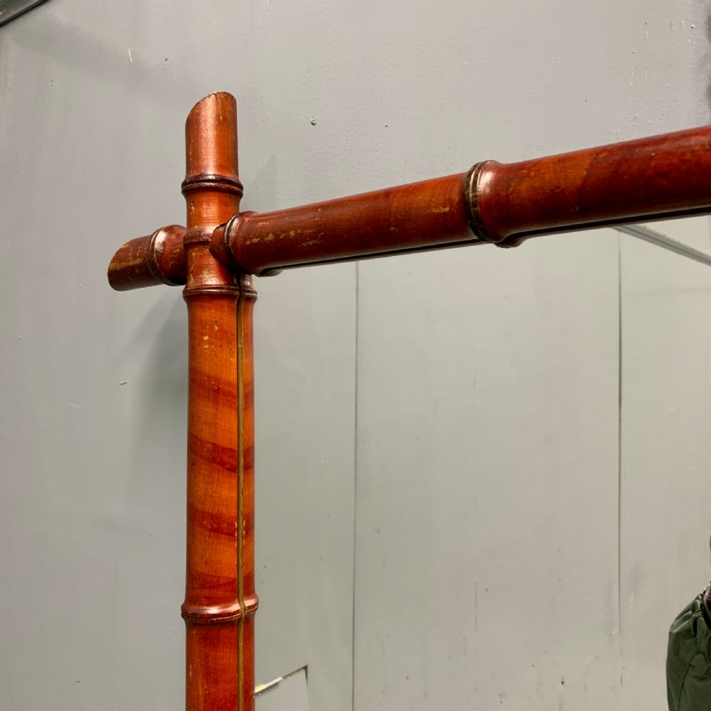Matched pair of red faux bamboo mirrors View VI