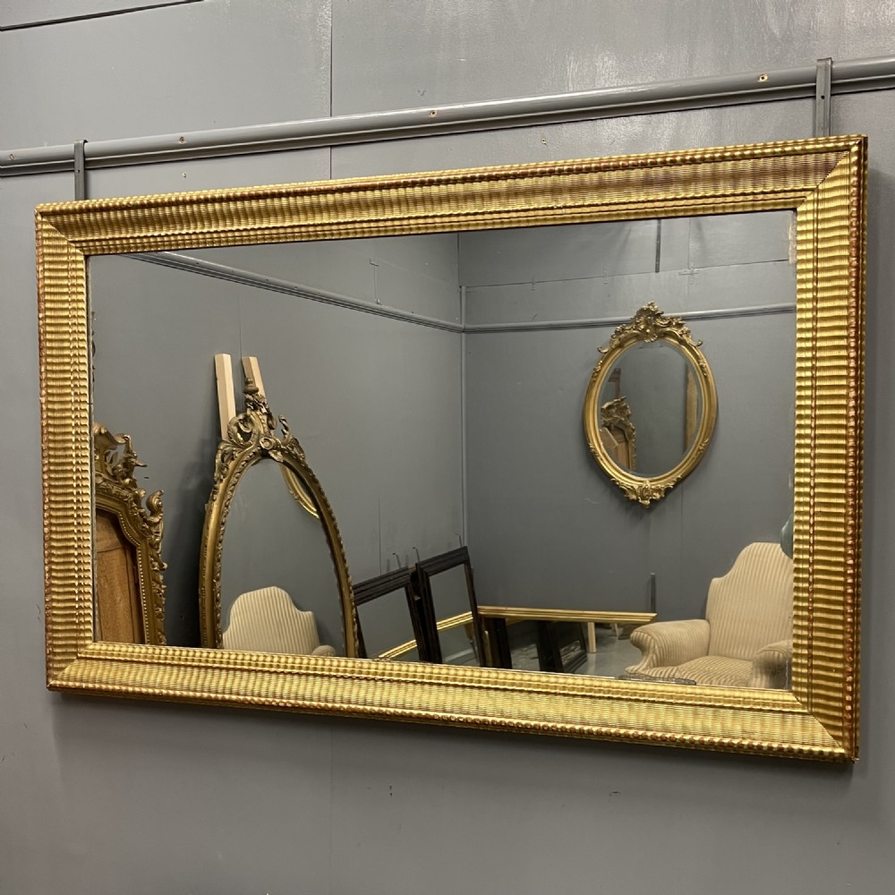 Large 19th century French rippled gilt mirror