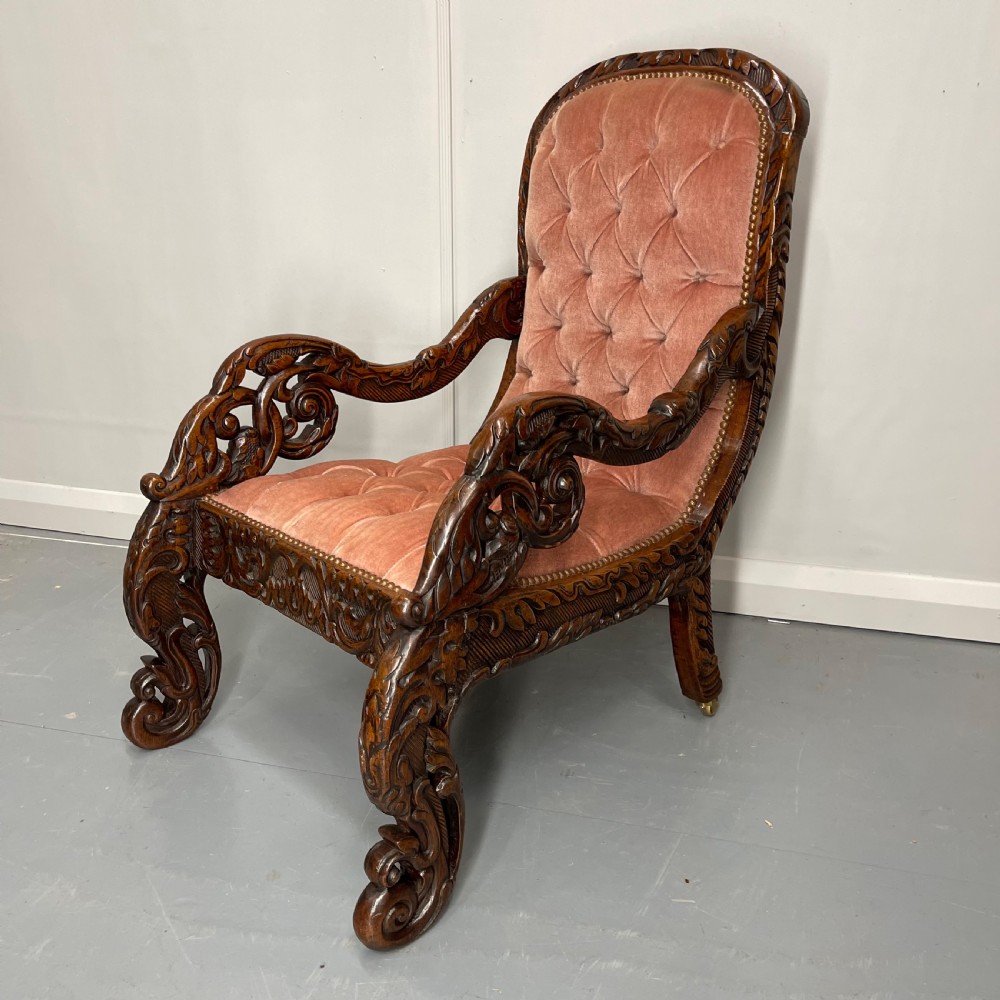 Carved walnut button back armchair