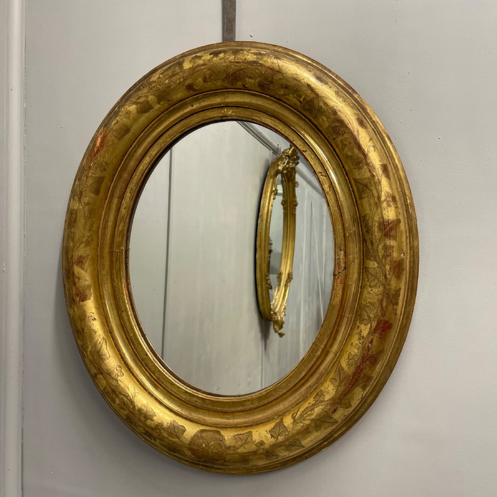 19th century French oval gilt mirror