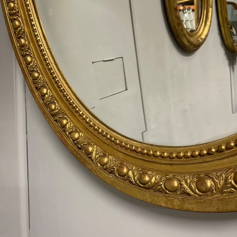 Large French oval gilt mirror with original glass View III