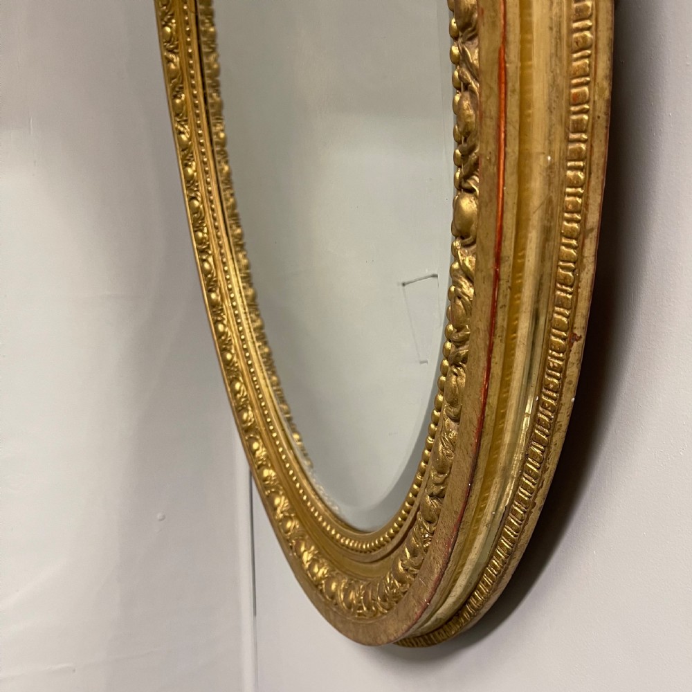 Large French oval gilt mirror with original glass View IV