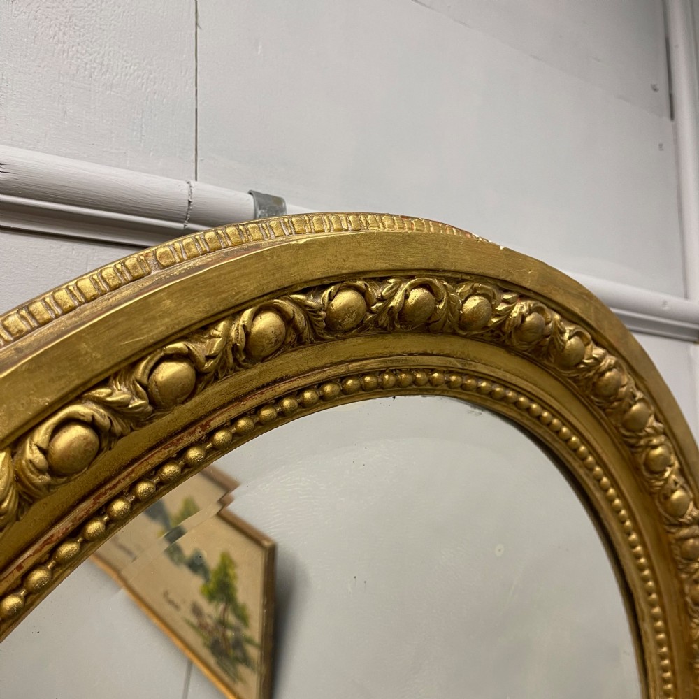 Large French oval gilt mirror with original glass View V