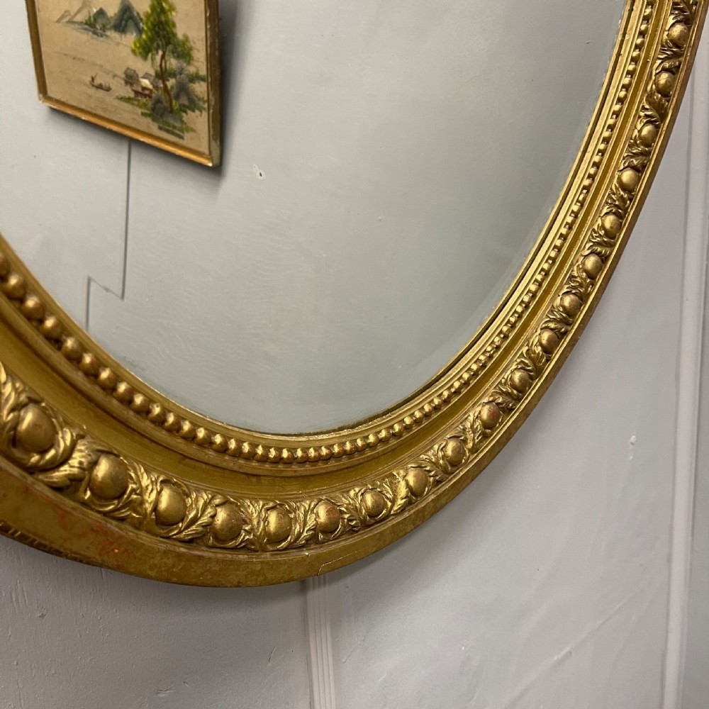 Large French oval gilt mirror with original glass View VI