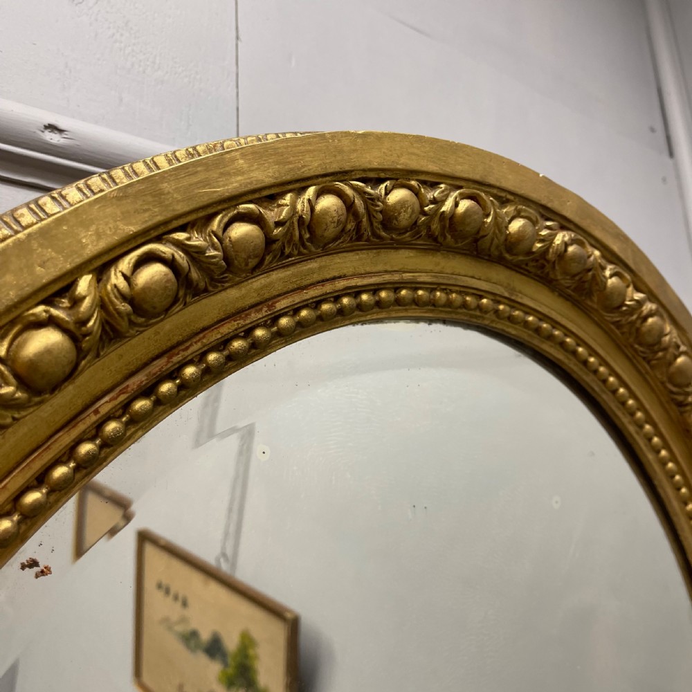 Large French oval gilt mirror with original glass View VIII