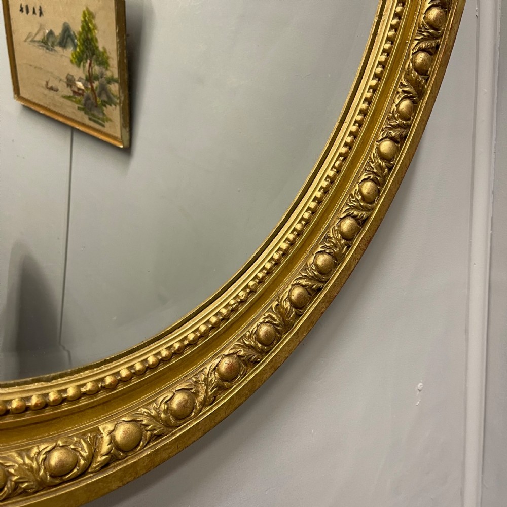 Large French oval gilt mirror with original glass View IX