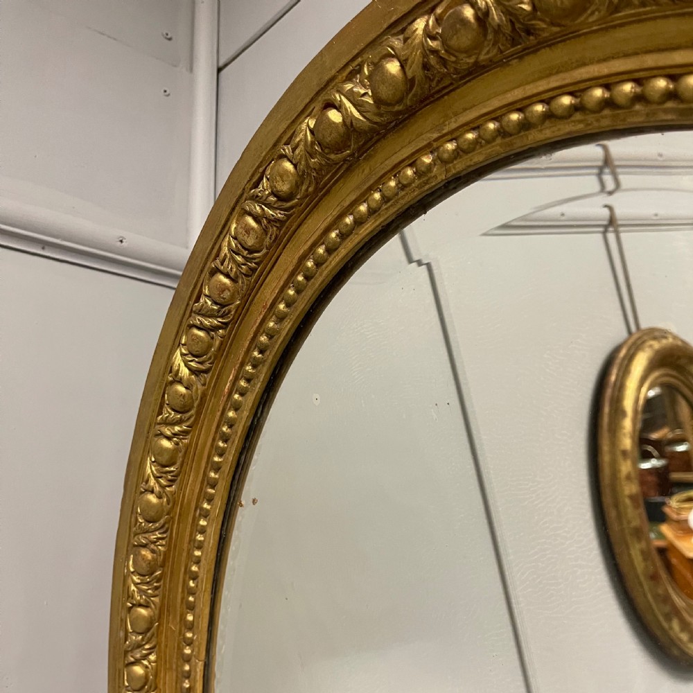 Large French oval gilt mirror with original glass View X
