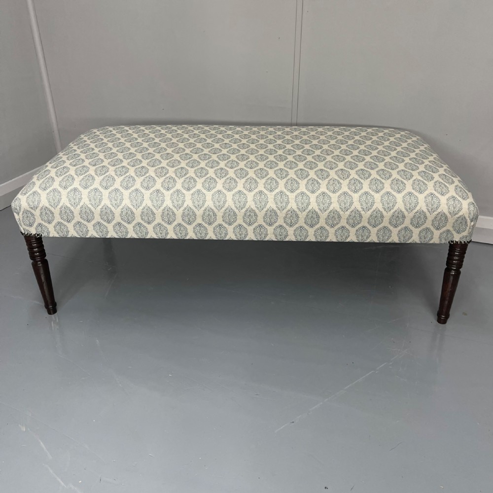 Regency footstool with turned legs and leaf motif View II