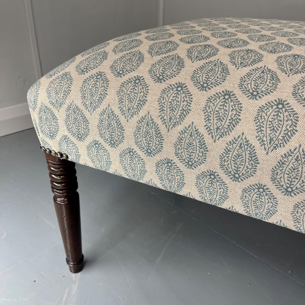 Regency footstool with turned legs and leaf motif View V