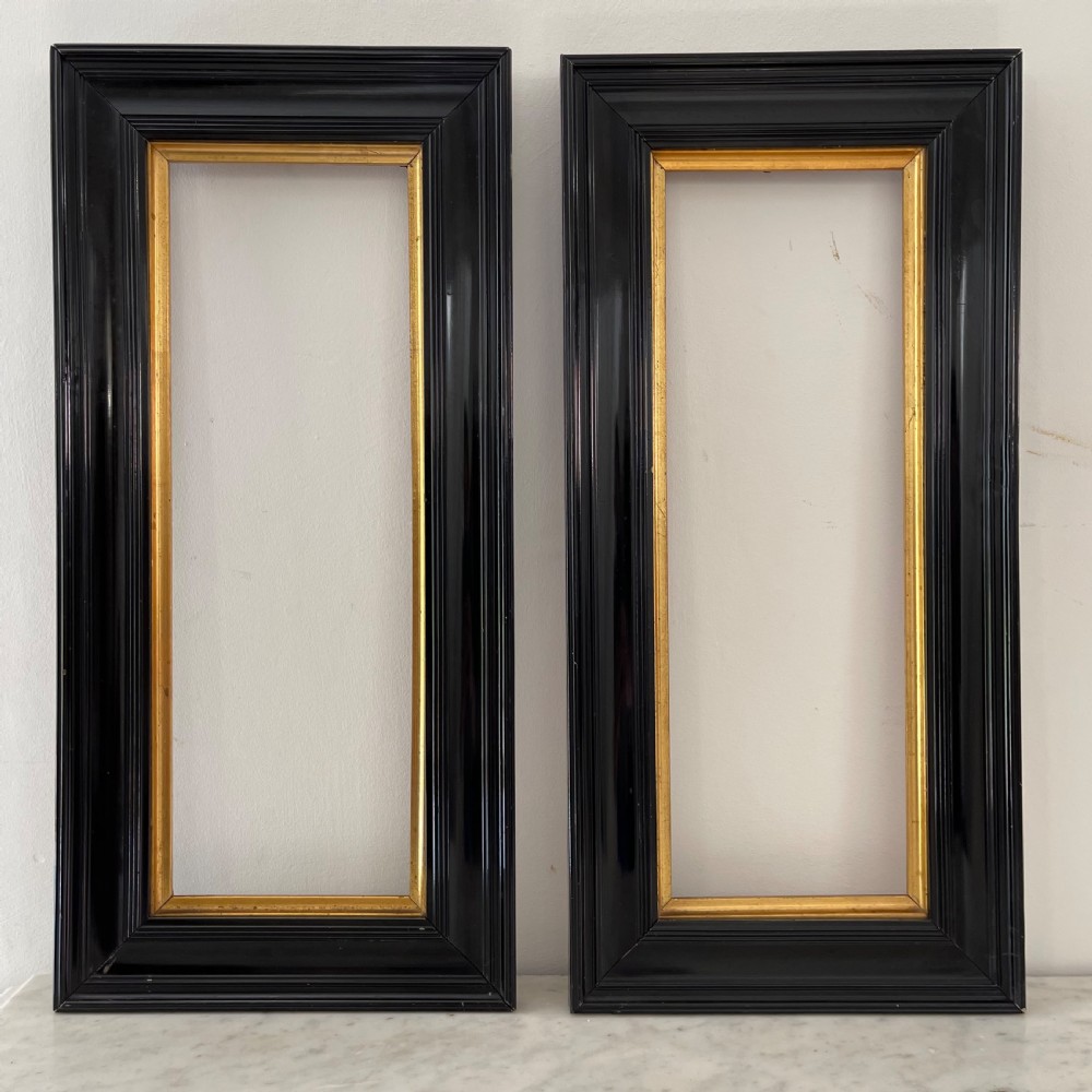 Pair of black lacquered pier mirrors 