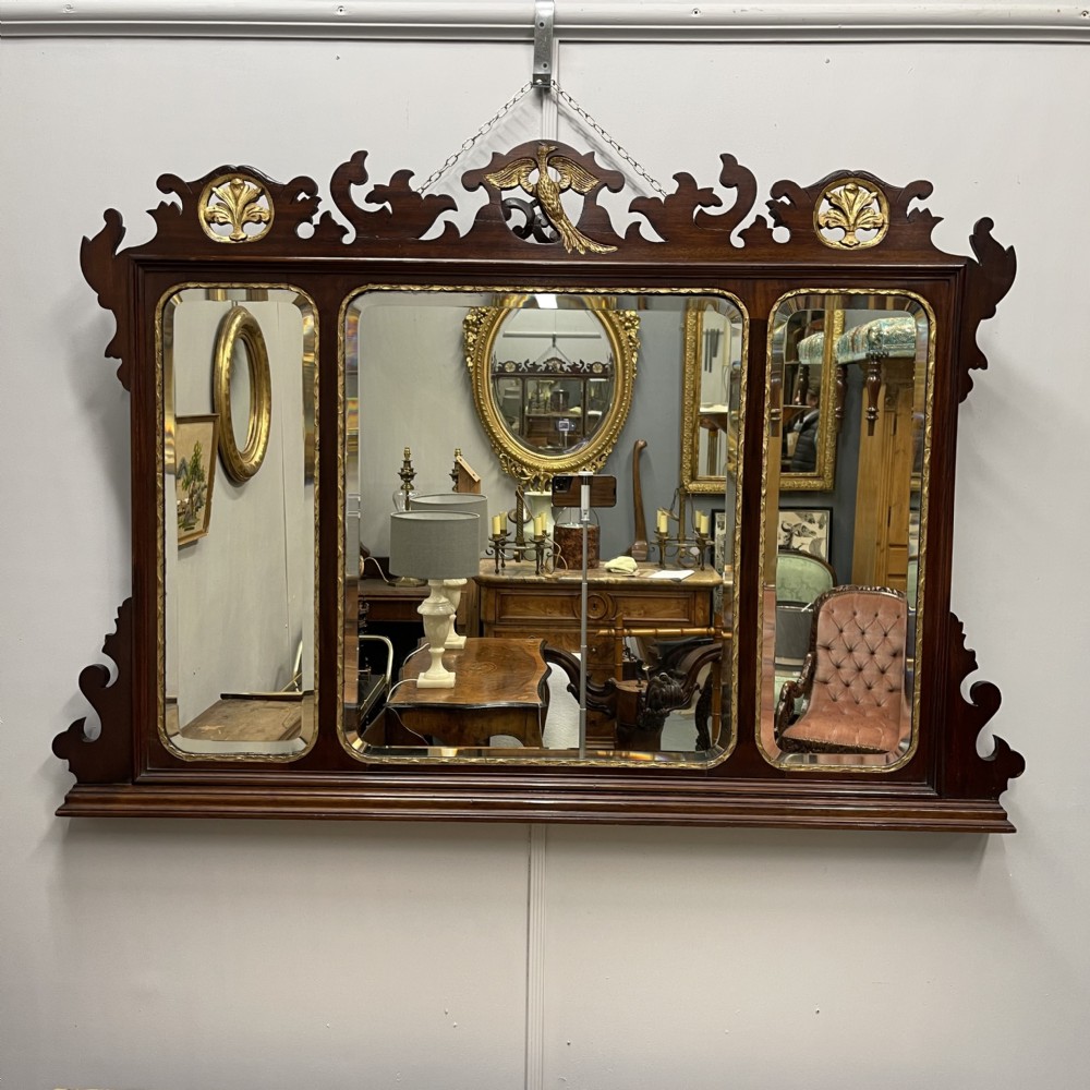 Unusual George II triple plate parcel gilt over mantle mirror