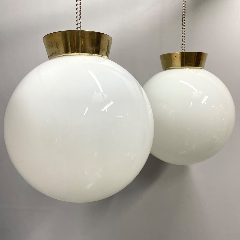Pair of opaline milk glass globe pendant lights View V