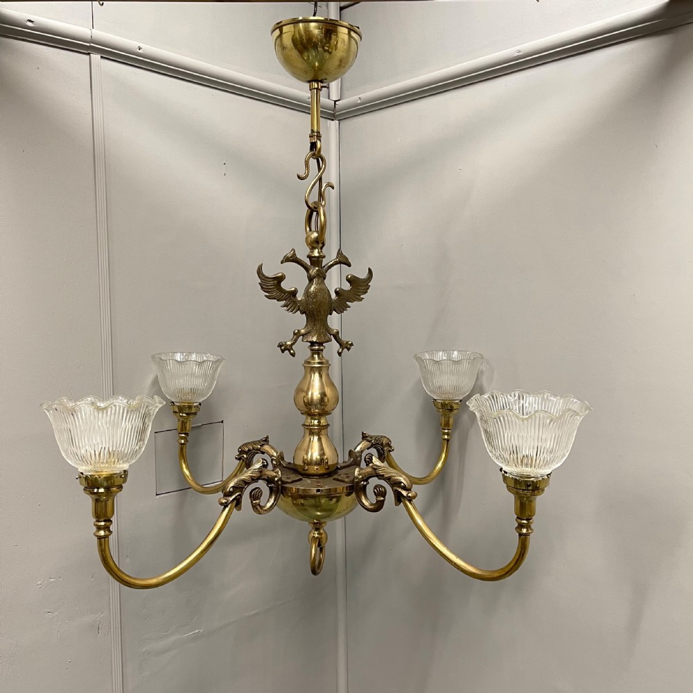 Large brass chandelier with holophane shades 