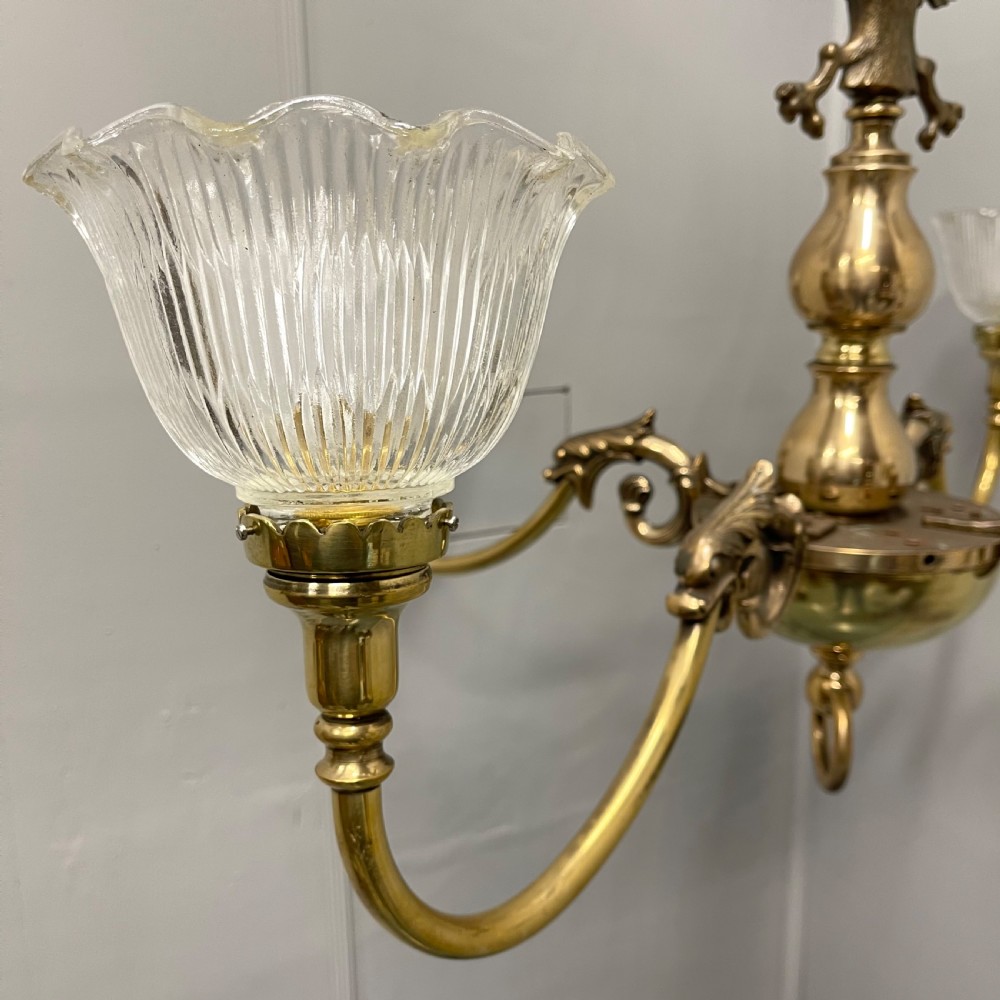 Large brass chandelier with holophane shades  View II