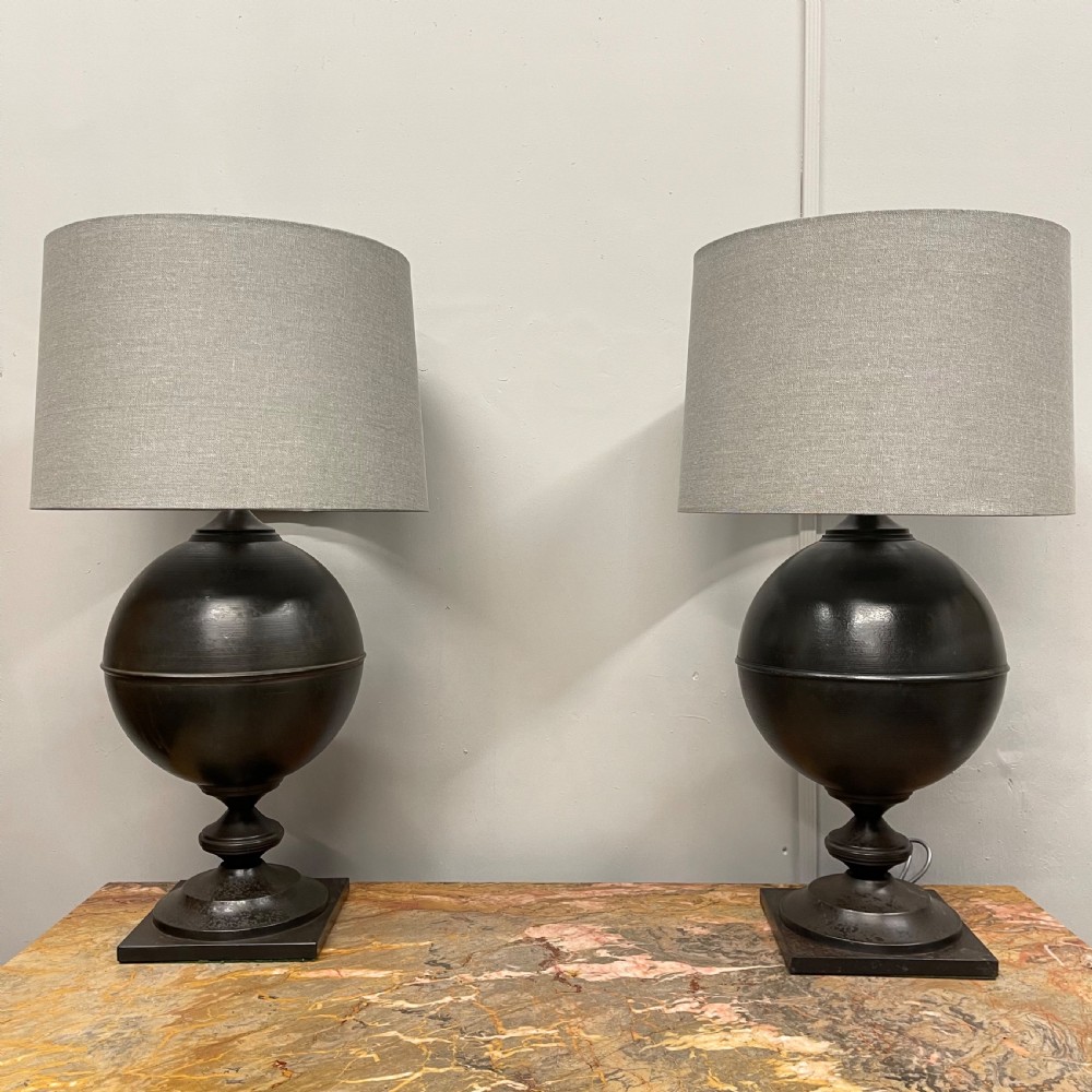 Pair of large black toleware finial lamps