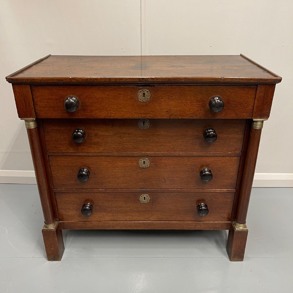 French Empire oak commode with black handles