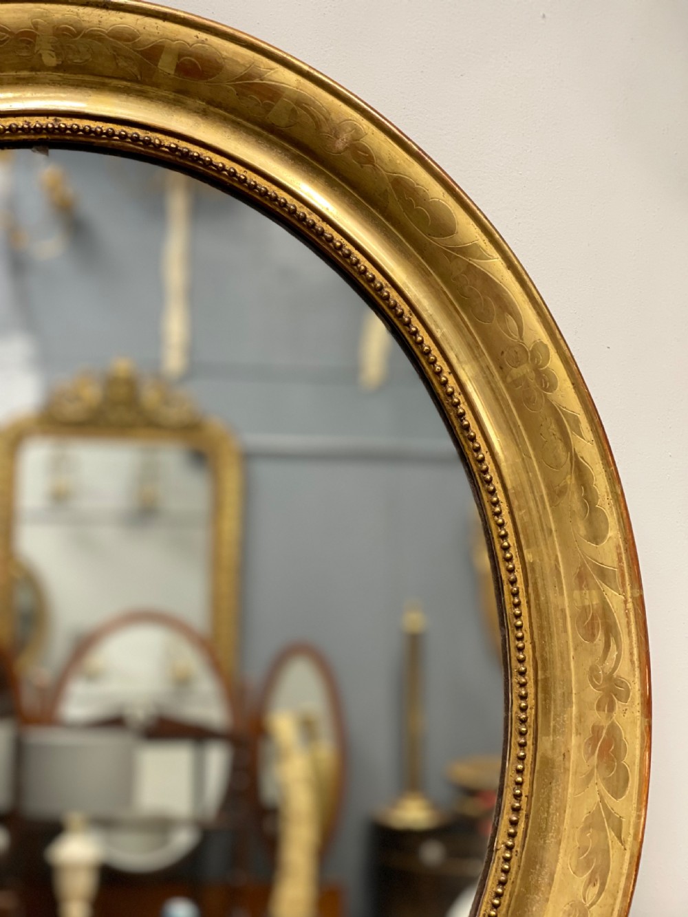 French oval figured gilt mirror View II