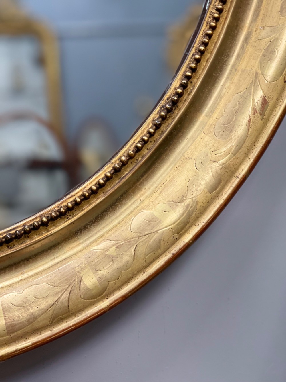 French oval figured gilt mirror View IV